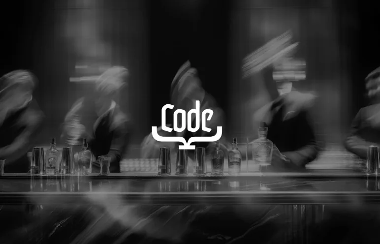 Code logotype over a black and white bar photo