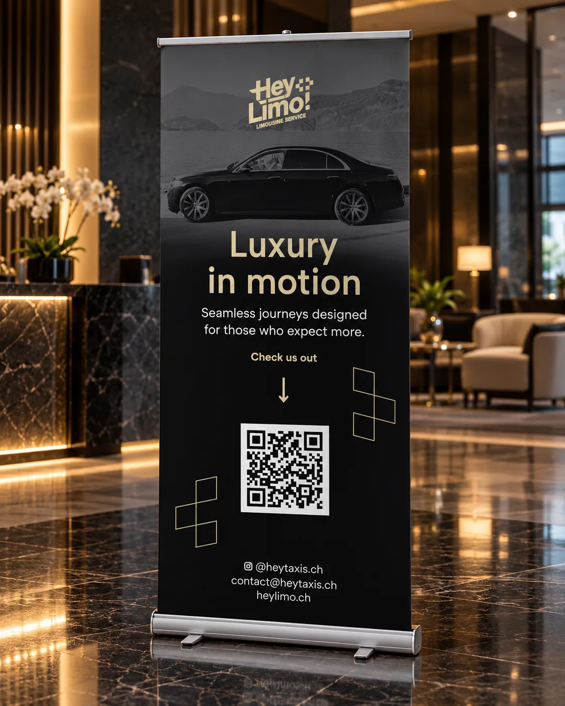 Hey Limo roll-up banner in a hotel lobby with the gold logo, a black Mercedes, the line Luxury in motion and a QR code
