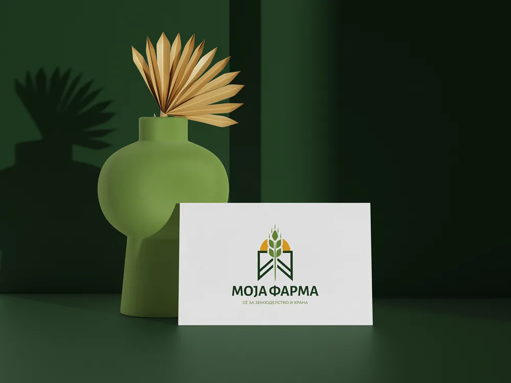 Moja Farma business card with the wheat logo