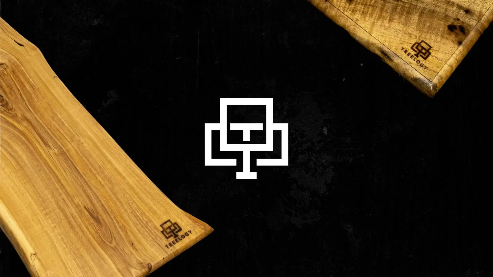 Treelogy tree logo between handmade wood tables